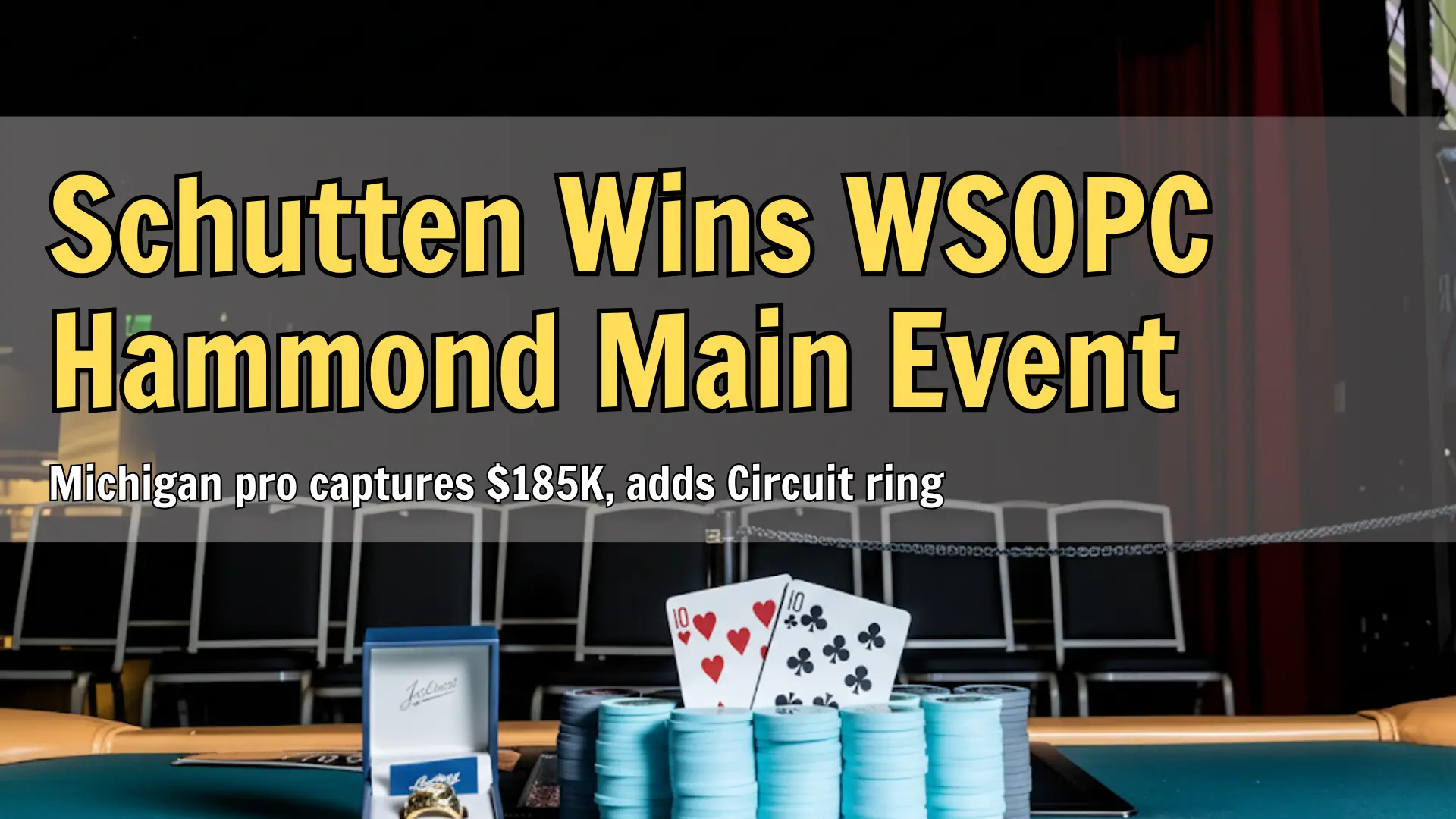 Poker championship ring, chip stacks, and winning cards on final table
