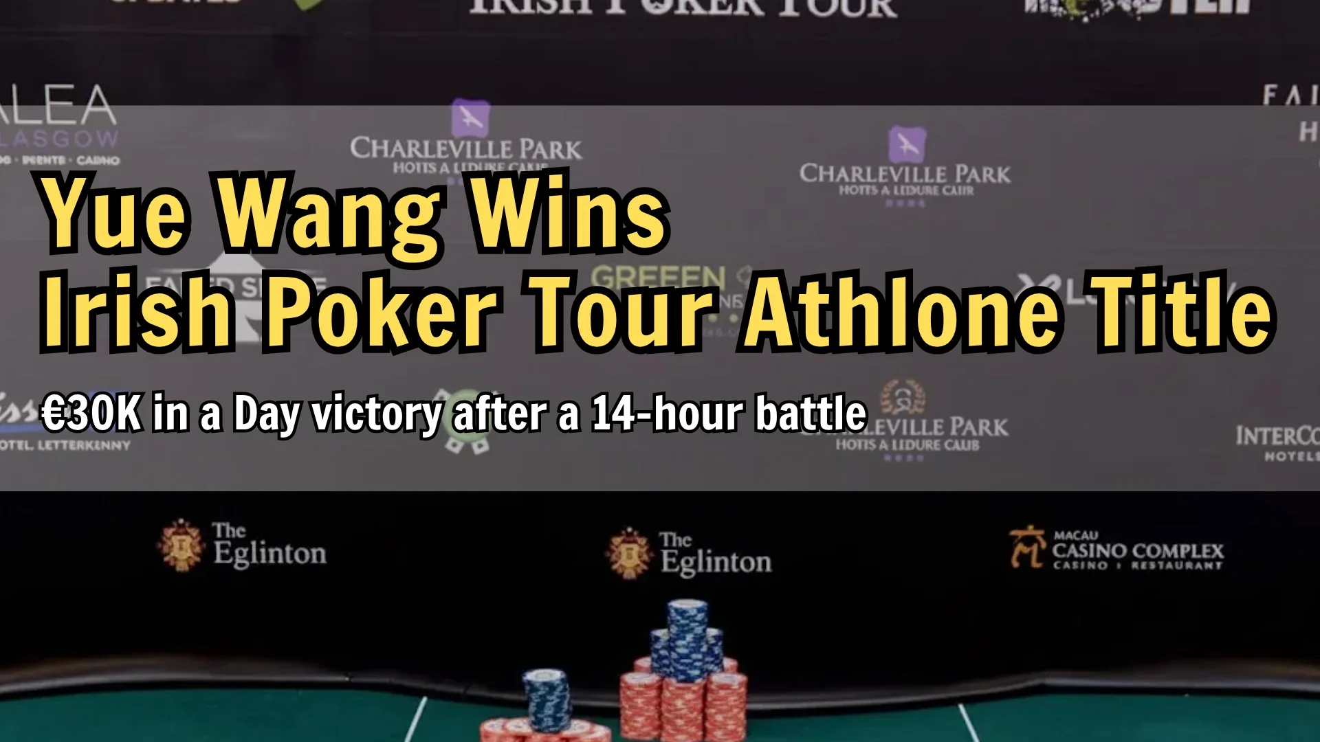 Poker chips and final board on the Irish Poker Tour table with event sponsors in the background