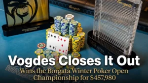 Close-up view of the Borgata Winter Poker Open championship trophies, poker chips, and Blake Vogdes' winning 4s5d hand on a blue felt table.