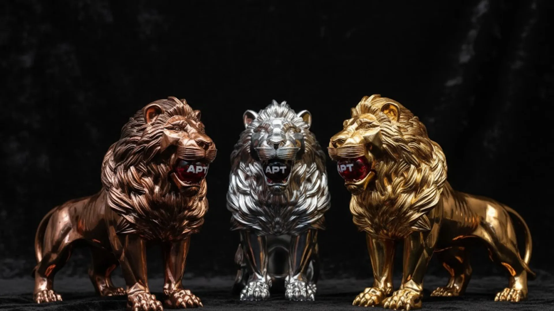 Three APT Lion Trophies in bronze, silver, and gold representing Asian Poker Tour flagship awards