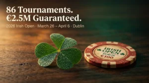 A dewy four-leaf clover and an Irish Open Dublin €100 poker chip on a dark wooden table, promoting the 2026 Irish Open with 86 tournaments and €2.5M guaranteed, March 26 to April 6 in Dublin